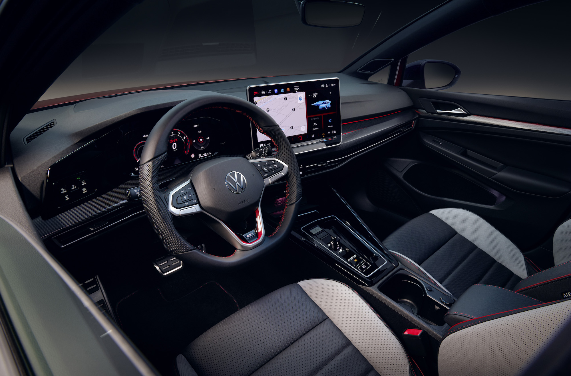 An image showing the interior of a new Volkswagen Gold including the steering wheel and touchscreen.