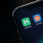 Logos of the Line Man and Wongnai apps on a smartphone display