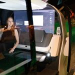 A gallery assistant sits inside the "Sedric" Volkswagen driverless concept car during the press launch of the exhibition; "The Future Starts Here" at Victoria and Albert Museum on May 9, 2018 in London, England.